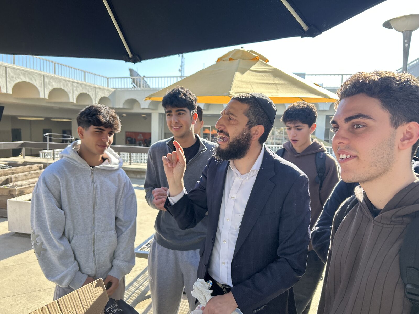 Rabbi Danny Illulian talking with students at BHHS